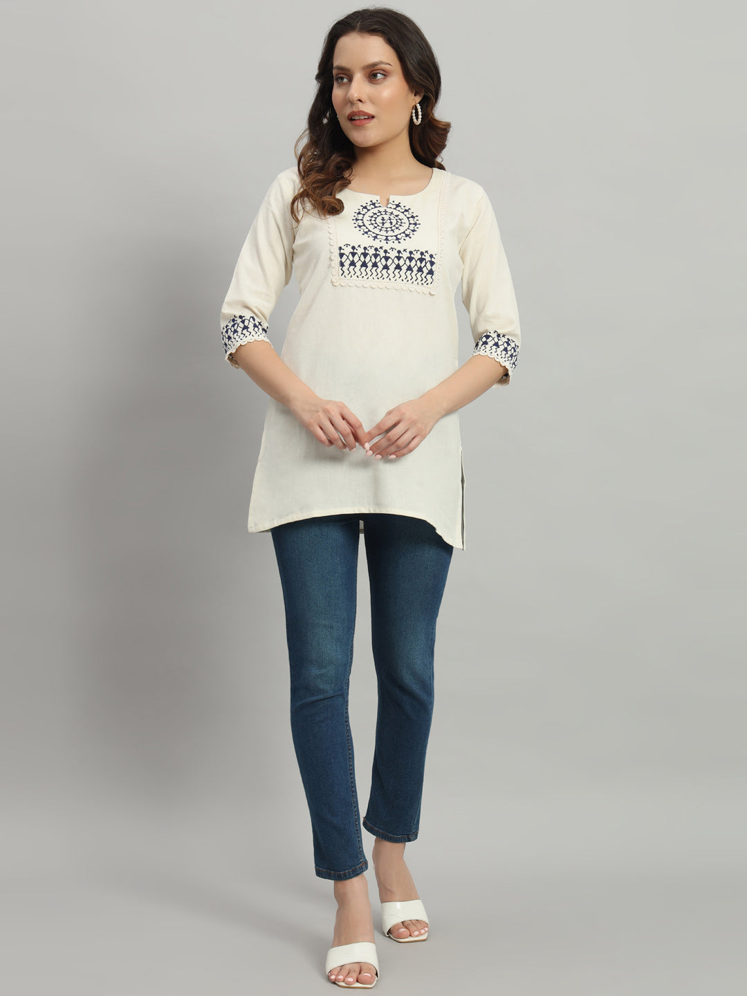 Elegant cream cotton kurti adorned with intricate blue warli print