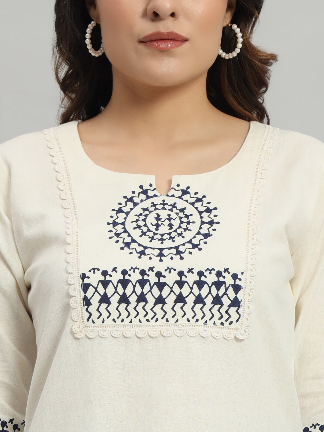 Elegant cream cotton kurti adorned with intricate blue warli print