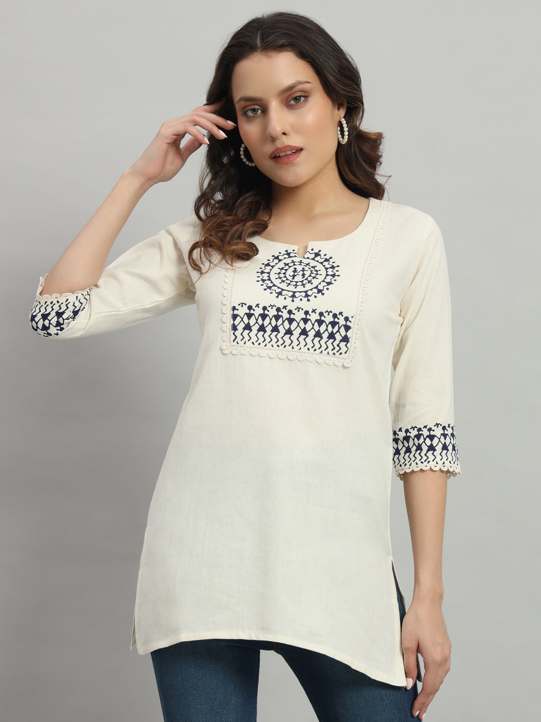 Elegant cream cotton kurti adorned with intricate blue warli print