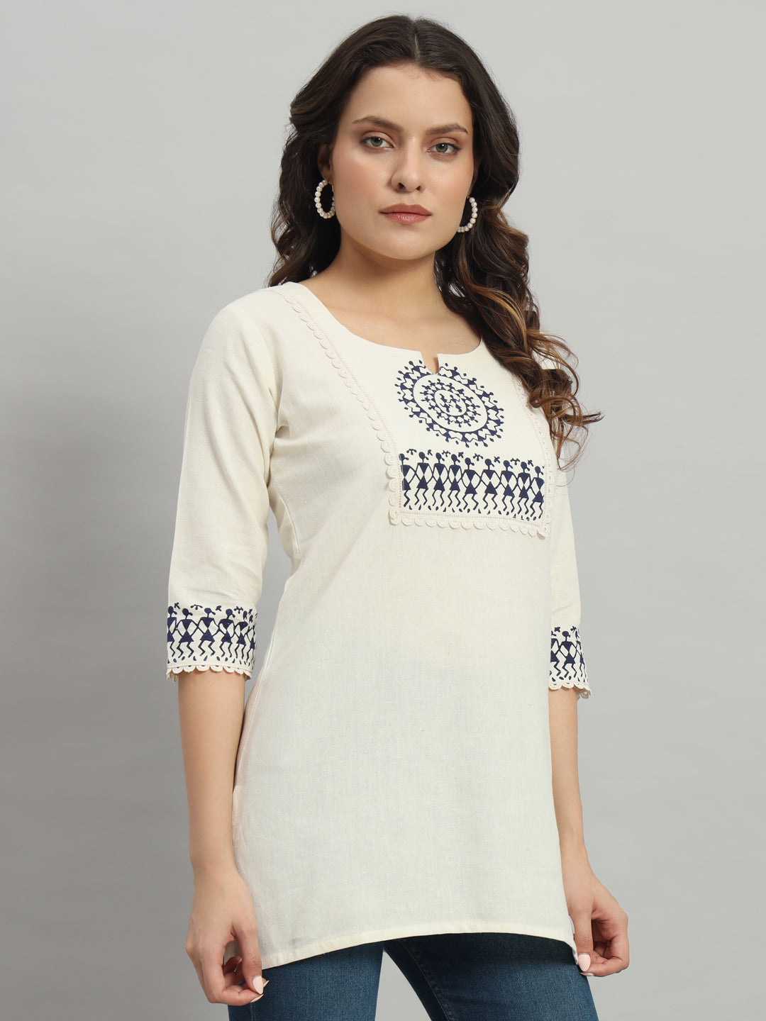 Elegant cream cotton kurti adorned with intricate blue warli print