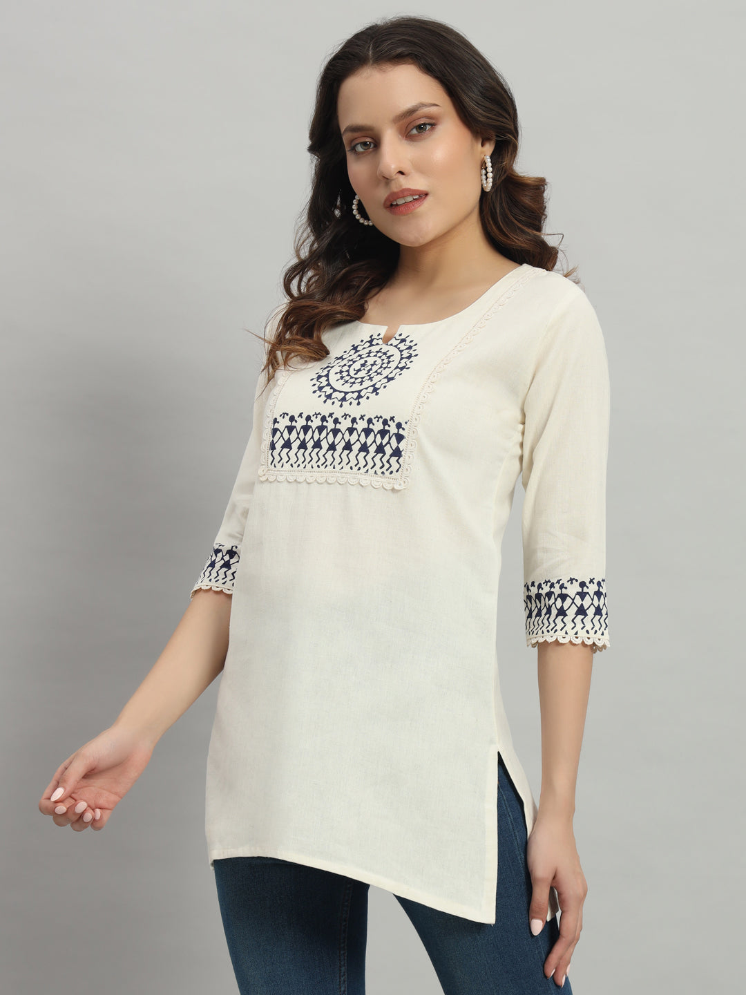 Elegant cream cotton kurti adorned with intricate blue warli print