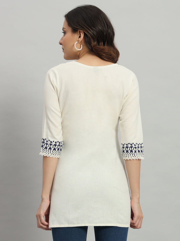 Elegant cream cotton kurti adorned with intricate blue warli print